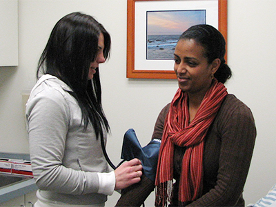 Medical Assistant taking blood pressure reading