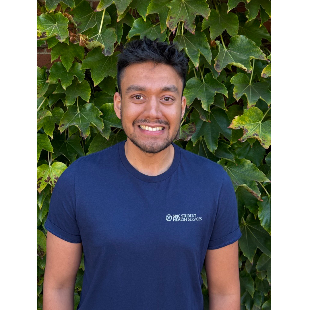 Portrait of Student Health Peer, Sahil Prasad in front of an ivy background.