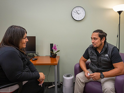 Student sitting down in room during therapy session