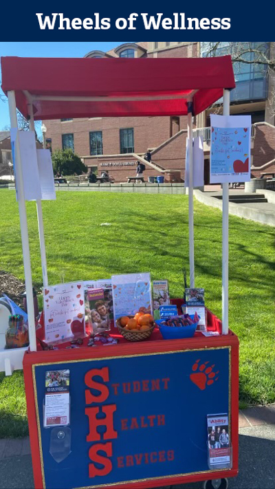 SHS Table and Wheels of Wellness at a JC Event on the Quad