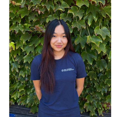 Portrait of Student Health Peer, Mina Nguyen in front of an ivy background.
