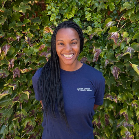 Portrait of Student Health Peer, LaShante Bonin in front of an ivy background.